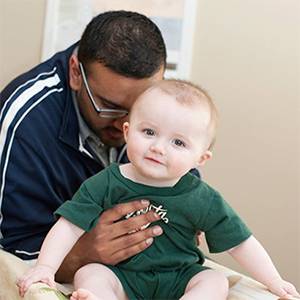 Chiropractor Blaine MN Dave Oommen and Child